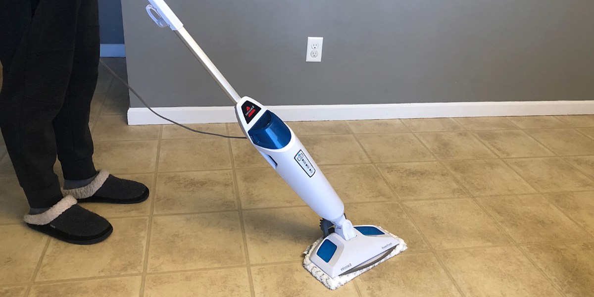 Person using Bissell PowerFresh Steam Mop on hard floor