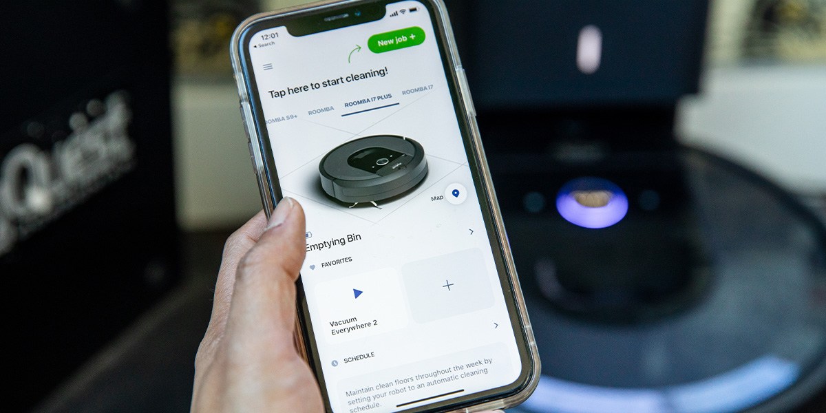 Person using iRobot Roomba j7+ smartphone application